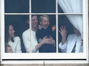Prince George of Cambridge is held by his nanny Maria Teresa Turrion Borrallo as he waves from the window of Buckingham Palace as he watches the Trooping The Colour ceremony on June 13, 2015 in London, England. Prince George and Princess Charlotte's nanny blended expertly into the background in St George's Chapel on Saturday, looking on from the sidelines as her little charges and their fellow bridesmaids and page boys performed their duties beautifully.