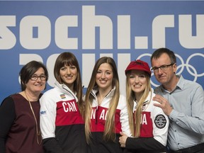 Skier sisters Maxime, left, Chloe and Justine Dufour-Lapointe, with their parents Johane Dufour, and Yves Lapointe at the Sochi Winter Olympics in Sochi on Sunday, February 9, 2014.
