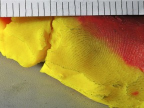 This undated photo released by the Leicester Police Department shows a fingerprint left in a hunk of Play-Doh that led them to a shoplifting suspect at a Walmart in December 2017. The suspect used the malleable clay-like toy in an apparent attempt to neutralize several electronic anti-theft devices. That attempt failed, but the suspect left a fingerprint impression. Police announced Wednesday, May 2, 2018, that the Connecticut Forensics Laboratory helped find a match for the print. (Leicester Police Department via AP) ORG XMIT: BX101