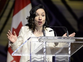 Bloc leader Martine Ouellet jokes during her speech at the Parliamentary Press Gallery Dinner at the Museum of History in Gatineau, Quebec on Saturday, May 26, 2018.