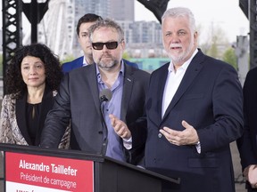 Alexandre Taillefer listens to Quebec Premier Philippe Couillard as he is presented as the Liberal party's campaign president for the fall election during a news conference Tuesday, May 15, 2018 in Montreal.