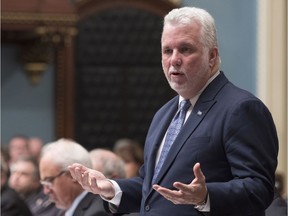 Quebec Premier Philippe Couillard responds to the Opposition, during question period, Tuesday, December 5, 2017 at the legislature in Quebec City.