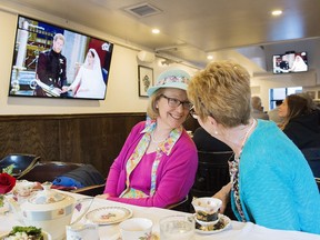 Royal fans react as they watch the royal wedding of Prince Harry and Meghan Markle at a bar in Montreal, Saturday, May 19, 2018.