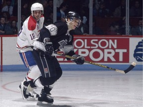 Montreal Canadiens' Denis Savard shadows Luc Robitaille of the Los Angeles Kings at the Montreal Forum during the 1990s.