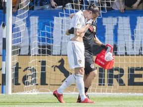 L.A. Galaxy's Zlatan Ibrahimovic is helped off the pitch during first half MLS soccer action against the Montreal Impact in Montreal, Monday, May 21, 2018.