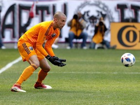 Montreal Impact goalkeeper Evan Bush collects the ball against the New York Red Bulls during the second half in Harrison, N.J., on April 14, 2018.