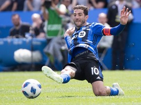Montreal Impact midfielder Ignacio Piattin slips as he kicks the ball during second half MLS action against the New England Revolution Saturday, May 5, 2018 in Montreal.