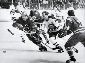 Guy Lafleur, who won five Stanley Cups with the Canadiens, tries to split the defence during game against the Colorado Rockies at the Montreal Forum. Lafleur scored at least 50 goals in six straight seasons with the Canadiens starting in 1974-75.
