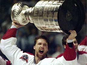 Patrick Roy hoists the Stanley Cup after the Montreal Canadiens beat Wayne Gretzky and the Los Angeles Kings in five games in 1993.