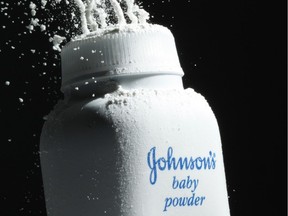 Johnson's baby powder is squeezed from its container.