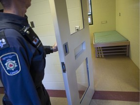 A corrections officer opens the door to a cell in the segregation unit at the Fraser Valley Institution for Women during a media tour, in Abbotsford, B.C., on Thursday October 26, 2017.