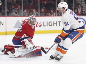 New York Islanders' John Tavares shoots the puck past Montreal Canadiens' Carey Price for a short-handed goal during second period in Montreal on Jan. 15, 2018.