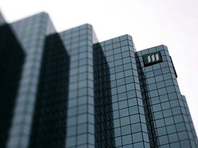 Signage is displayed outside the Manulife Financial Building in this photo taken with a tilt-shift lens in Ottawa, Ontario, Canada, on Tuesday, Aug. 9, 2011. Canada's trade deficit widened more than forecast in June, signaling that the economy may have stalled or even contracted in the second quarter. Photographer: Brent Lewin/Bloomberg ORG XMIT: POS2013031911222593