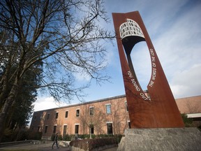 A student walks past the bell tower on campus at Trinity Western University in Langley, B.C., on Wednesday, February 22, 2017.