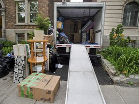 A removal truck waits to be unloaded on what's become known as Moving Day, in Montreal.