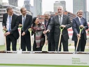 The Caisse's Michael Sabia, far right, breaks ground on the REM with (from left) Jean-Marc Arbaud of CDPQ Infra; Henri Poupart-Lafarge of Alstom; Montreal Mayor Valerie Plante; federal Transport Minister Marc Garneau and Quebec Premier Philippe Couillard April 12, 2018.