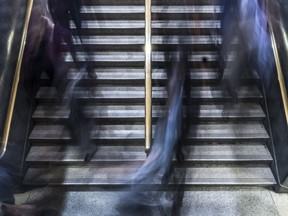 Commuters board the trains on Deux-Montagnes line at Central Station in Montreal.