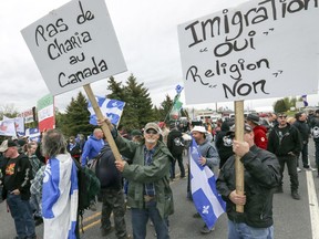 Members of right-wing group Storm Alliance protest near the Canada-U.S. border at Lacolle, south of Montreal, May 19, 2018.