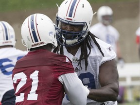 Montreal Alouettes' Xavier Fulton, right, with Chris Ackie during the Als practice at Olympic Stadium on Tuesday May 22, 2018.