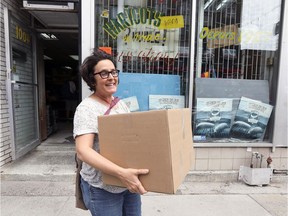 Gabriella Coleman leaves Segal's on St-Laurent Blvd. with a box of groceries May 31, 2018.