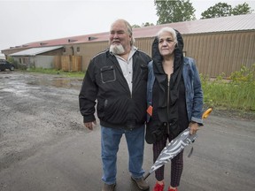 Blake and Anna Freeman are seen outside the old bingo hall in Kanesatake, the site of a planned cannabis grow-op, 
on Monday, June 4, 2018.
