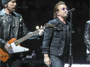 The Edge, left, Bono perform during U2 concert at the Bell Centre in Montreal Tuesday June 5, 2018.