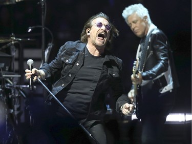 Bono and Adam Clayton onstage during U2 concert at the Bell Centre in Montreal Tuesday June 5, 2018.