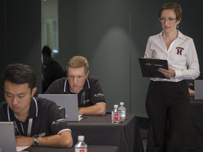 Julia Minson, a Harvard professor doing research into decision-making behind the wheel, observes participants in the Infiniti Engineering Academy held at Spinelli Infiniti in Pointe-Claire Wednesday, June 6, 2018.