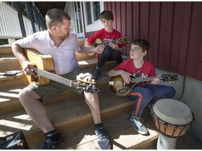 Tim Walsh (left) jams with brothers Kyle and Nilan Vergnano-Mcrae (right) at the Stephen F. Shaar Community Centre in Hudson on Saturday.