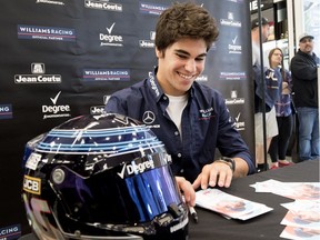 Lance Stroll signs autographs for fans in Montreal on Wednesday, June 6, 2018.