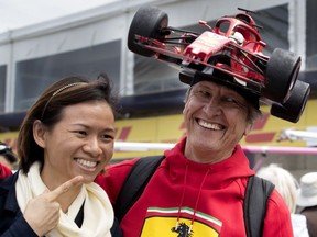 Tracey Wong-Kayin poses for a picture with fellow Formula One fan Kim Reimer, right, during open house events at Circuit Gilles Villeneuve in Montreal on Thursday June 7, 2018.
