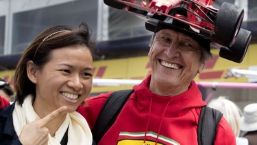 Tracey Wong-Kayin poses for a picture with fellow Formula One fan Kim Reimer, right, during open house events at Circuit Gilles Villeneuve in Montreal on Thursday June 7, 2018.