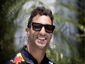 Red Bull driver Daniel Ricciardo flashes his trademark grin in the paddocks at Circuit Gilles Villeneuve.
