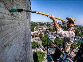 Artist Kevin Ledo is just getting started with his mural of Leonard Cohen on a building wall at St-Dominique Street and Napoleon Street in Montreal, on Thursday, June 8, 2017 for Mural Fest.