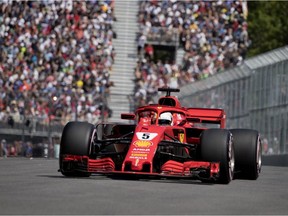 Ferrari driver Sebastian Vettel of Germany captures the pole position during qualifying at the Canadian Grand Prix in Montreal on Saturday, June 9, 2018.
