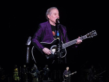 Paul Simon is projected on to a huge screen as he performs in Montreal on Wednesday June 13, 2018.