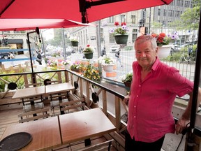 Elio Schiavi, owner of Ferrari restaurant, stands on his terrasse on Bishop St. on Wednesday. Schiavi has managed to keep his restaurant open, despite incurring losses, while many of his neighbours have closed because city construction is driving away business.