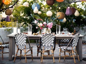 Details like arranged flowers, candles and table linens make outdoor dining more sophisticated.