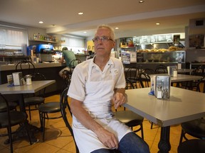 Paolo Momesso sits in his nearly empty restaurant during the 2018 FIFA World Cup tournament in Montreal on June 18, 2018. The restaurant would normally be full if the Italian team were in the tournament.