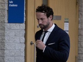 Patrick Ouellet, a police officer charged with dangerous driving causing the death of Nicholas Thorne-Belance, arrives in court at the Palais de Justice de Longueuil to testify in his trial on June 18, 2018.