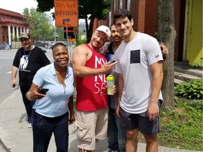 Montreal Canadiens captain Max Pacioretty, right, poses with volunteers at the Open Door shelter in Westmount. Pacioretty donated food to the Open Door on June 18, 2018.