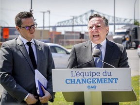 If elected Oct. 1, the Coalition Avenir Québec would implement a $10-billion 10-year transportation plan, CAQ leader François Legault said at a press conference on Notre-Dame St. June 20, 2018, flanked by CAQ transport critic Benoit Charest.  (John Mahoney / MONTREAL GAZETTE)