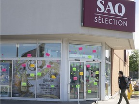 MONTREAL, QUE.: JUNE 22, 2018 --  Stickers on the windows of the SAQ store on corner of Jean Talon and Pie-IX on Friday June 22, 2018. The employees are set to go on strike as early as Saturday. (Pierre Obendrauf / MONTREAL GAZETTE) ORG XMIT: 60943 - 4340