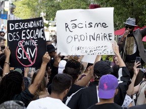 Protestors demonstrate against SLAV outside the Théâtre du nouveau monde in Montreal on Tuesday June 26, 2018.