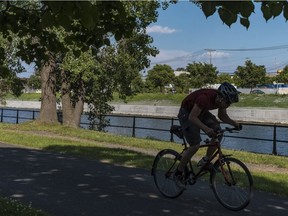 A seven-kilometre stretch of the western sector of the Lachine Canal bike path in Montreal, on Friday, June 29, 2018 which had been closed since mid-April for work on the canal walls and to update the lighting system, has reopened just in time for the Canada Day weekend.