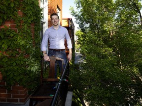 Jordan Matte on the small but private balcony in his home in the Plateau.