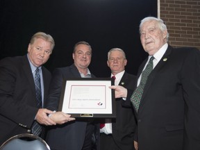 Joe Mell of Leo's Boys Sports Association is honoured at the annual Point-St-Charles Hall of Recognition breakfast and receives an award from Hockey Canada on Sept. 9, 2017. From left:  Kevin Figsby, Greg Choules, Howie Myers, Joe Mell.