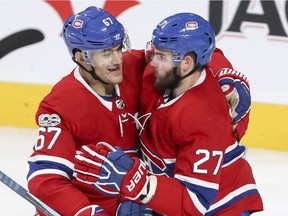 Canadiens captain Max Pacioretty (left) embraces Alex Galchenyuk after Galchenyuk scored a goal against the Florida Panthers in an NHL game at the Bell Centre in Montreal on Oct. 24, 2017.