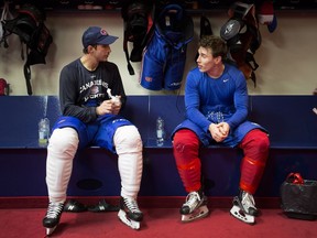 Brian Flynn (left) and Brendan Gallagher chat in Canadiens’ locker room at the Bell Sports Complex in Brossard after practice on Nov. 10, 2015.