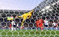 England goalkeepr Jordan Pickford can't stop a shot by Belgium's Adnan Januzaj during Thursday's game. (GETTY IMAGES)